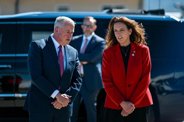Republican senatorial candidate in North Carolina Michael Whatley and Republican congressional candidate Jennifer Balkcom, wait to greet US Vice President JD Vance on the tarmac upon Vance's arrival at Asheville Regional Airport in Fletcher, North Carolina on October 19, 2026. (Photo by Kenny Holston/The New York Times / POOL / AFP)