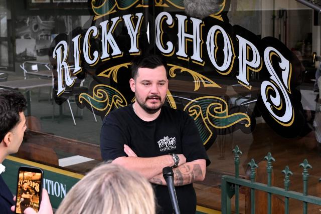 Barber Ricky Jefferies speaks to the media a day after tackling a man who attacked Australian politician Helen Haines in the northern regional city of Wangaratta, about 250 kilometres north-east of Melbourne on October 20, 2026. Australian independent lawmaker Helen Haines underwent surgery overnight but remains in a critical condition after being struck deliberately by a car in an attack, Prime Minister Anthony Albanese said on October 20. Political violence is rare in Australia, but law enforcement have documented a steady rise in threats and abuse directed towards the nation's elected officials in recent years. (Photo by William WEST / AFP)
