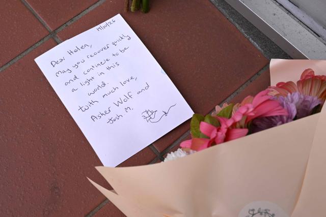 Flowers are placed outside the office of Australian politician Helen Haines in the northern regional city of Wangaratta, about 250 kilometres north-east of Melbourne on October 20, 2026. Australian independent lawmaker Helen Haines underwent surgery overnight but remains in a critical condition after being struck deliberately by a car in an attack, Prime Minister Anthony Albanese said on October 20. Political violence is rare in Australia, but law enforcement have documented a steady rise in threats and abuse directed towards the nation's elected officials in recent years. (Photo by William WEST / AFP)