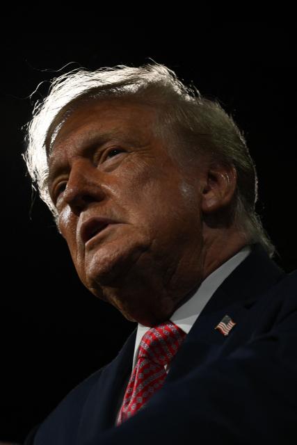 US President Donald Trump looks on during a campaign rally at the Heartland Credit Union Arena in Park City, Kansas, a suburb of Wichita, on October 19, 2026. (Photo by Kent NISHIMURA / AFP)