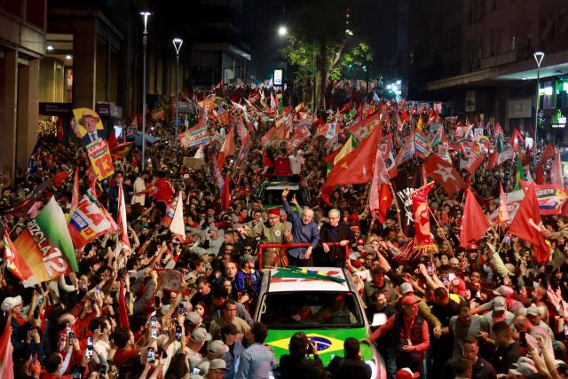 Brazil's President and presidential candidate Luiz Inacio Lula da Silva (C) of the Workers' Party (PT) greets supporters during a campaign rally in Porto Alegre, Rio Grande do Sul state, Brazil, on October 19, 2026, ahead of the presidential runoff election. (Photo by SILVIO AVILA / AFP)