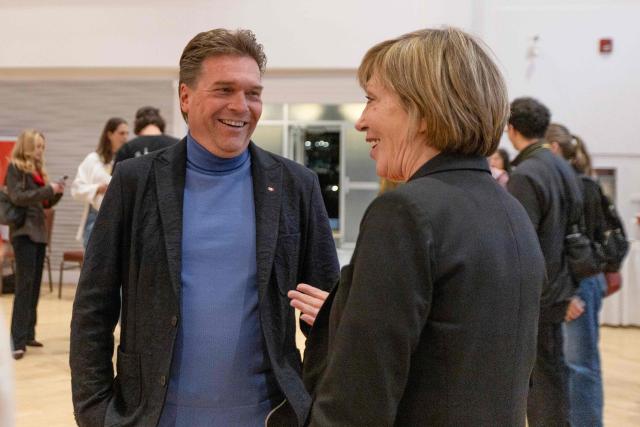 Thomas Lukaszuk, former Alberta deputy premier and leader of the Forever Canadian campaign, speaks with a supporter advocating for Alberta to remain part of Canada at a rally at Polish Hall in downtown Edmonton, Alberta, ahead of the referendum results on October 19, 2026. Alberta votes today to determine if it wants to pursue a binding referendum on leaving Canada, with Prime Minister Mark Carney warning a separatist win would bring dangerous uncertainty during a trade war with the United States. Polls indicate less than a quarter of people in the western Canadian province support independence. (Photo by Megan Albu / AFP)