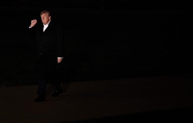 US President Donald Trump walks across the South Lawn after arriving on Marine One at the White House in Washington, DC, on October 19, 2026. President Trump is returning from Wichita, Kansas where he held a campaign rally ahead of the midterm elections. (Photo by Brendan Smialowski / AFP)