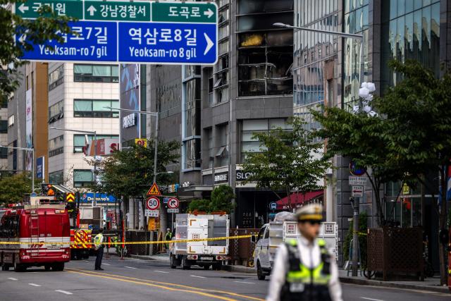 A street view shows a scene of a fire at a building in the Gangnam district of Seoul on October 20, 2026. (Photo by Philip FONG / AFP)