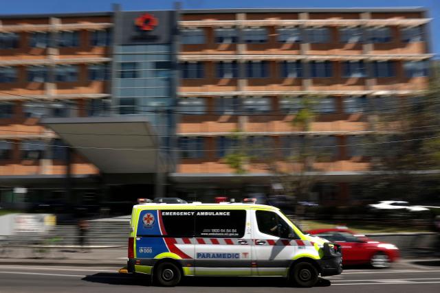 An ambulance arrives at the emergency department of the Alfred Hospital, where Australian politician Helen Haines is receiving treatment, in Melbourne on October 20, 2026. Australian lawmaker Helen Haines has lost a leg after being struck by a car in a deliberate attack, local media said October 20. (Photo by Martin KEEP / AFP)