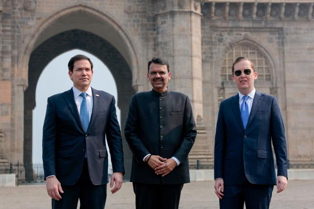 US Secretary of State Marco Rubio (L) poses for a photo with Maharashtra Chief Minister Devendra Fadnavis (C) and US Ambassador to India Sergio Gor at the Gateway of India in Mumbai on October 20, 2026. (Photo by Kylie Cooper / POOL / AFP)