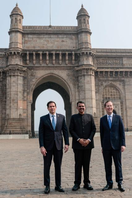 US Secretary of State Marco Rubio (L) poses for a photo with Maharashtra Chief Minister Devendra Fadnavis (C) and US Ambassador to India Sergio Gor at the Gateway of India in Mumbai on October 20, 2026. (Photo by Kylie Cooper / POOL / AFP)