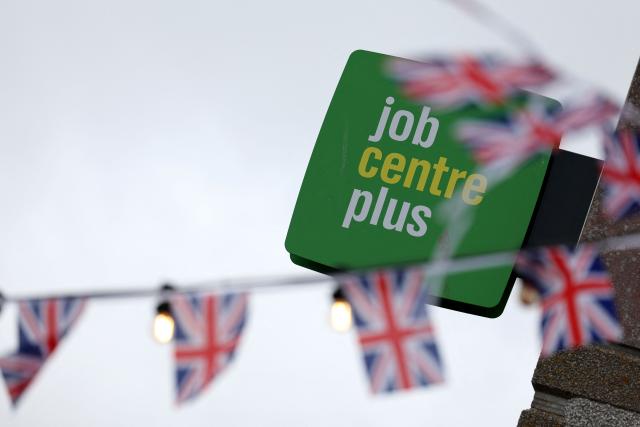 (FILES) A sign for 'Job Centre Plus' is pictured in Newquay, south west England on September 2, 2025. Britain's unemployment rate fell unexpectedly in the three months to the end of August, official data showed Tuesday, October 20, boosting the Labour government ahead of its budget update next week. (Photo by Adrian Dennis / AFP)