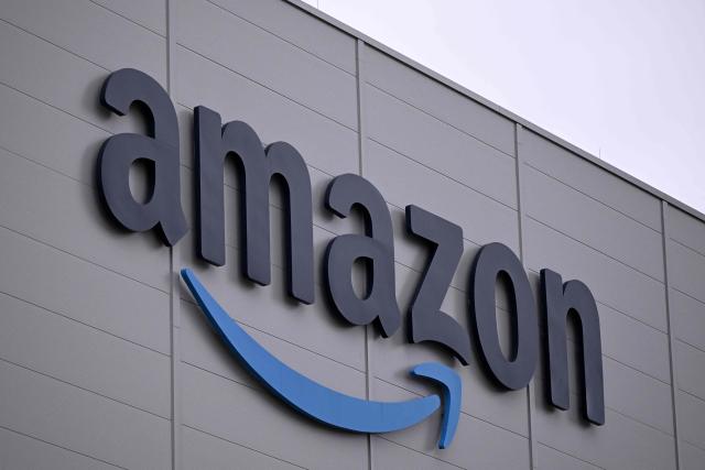(FILES) The logo of US online retail giant Amazon is seen on the facade of a redistribution centre in Horn-Bad Meinberg, western Germany, on December 9, 2024. US tech giant Amazon on October 20, 2026 announced plans to invest over 16 billion euros ($18 billion) in Germany next year, including on data centres and other infrastructure underpinning the artificial intelligence revolution. (Photo by Ina FASSBENDER / AFP)