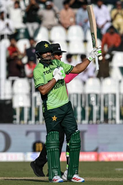 Pakistan's Hasan Nawaz celebrates after scoring a half-century (50 runs) during the one-day international (ODI) tri-series cricket match between Pakistan and England at the Rawalpindi Cricket Stadium in Rawalpindi on October 20, 2026. (Photo by Aamir QURESHI / AFP)