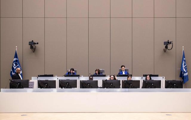 (FILES) Judges (top row from left) Tomoko Akane, Kimberly Prost and Keebong Paek sit prior to the announcement of the International Criminal Court (ICC) verdict that sentenced Malian Jihadist police chief Al Hassan Ag Abdoul Aziz Ag Mohamed Ag Mahmoud to 10 years in jail for war crimes and crimes against humanity committed during a reign of terror in the fabled Malian city of Timbuktu, on November 20, 2024 at the ICC court in The Hague. On October 19, 2026, members of the European Parliament on the Foreign Affairs Committee selected as finalists for the Sakharov Prize the finalists the International Criminal Court (ICC) and its staff, alongside Tanzanian lawyer and opposition figure Tundu Lissu, and the Rahimi sisters, two Iranian women who have received heavy sentences in their country for taking part in anti-government protests. (Photo by Eva Plevier / POOL / AFP) / Netherlands OUT