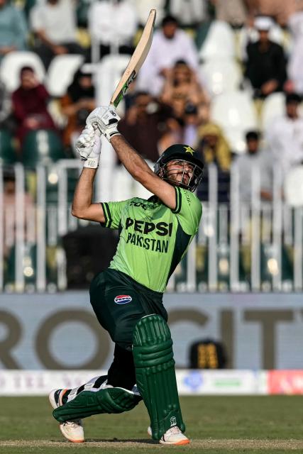 Pakistan's Arafat Minhas watches the ball after playing a shot during the one-day international (ODI) tri-series cricket match between Pakistan and England at the Rawalpindi Cricket Stadium in Rawalpindi on October 20, 2026. (Photo by Aamir QURESHI / AFP)
