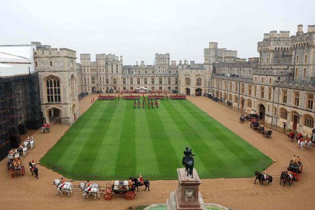 The Irish State Coach carrying Britain's King Charles III, Oman's Sultan Haitham bin Tariq and the Scottish State Coach carrying Britain's Queen Camilla and H.H. Sayyid Shihab bin Tariq Al Said, Deputy Prime Minister for Defence Affairs arrive in the Quadrangle of Windsor Castle, Windsor, on October 20, 2026, the first day of a three-day State Visit to the United Kingdom by The Sultan of Oman. (Photo by Chris Jackson / POOL / AFP)