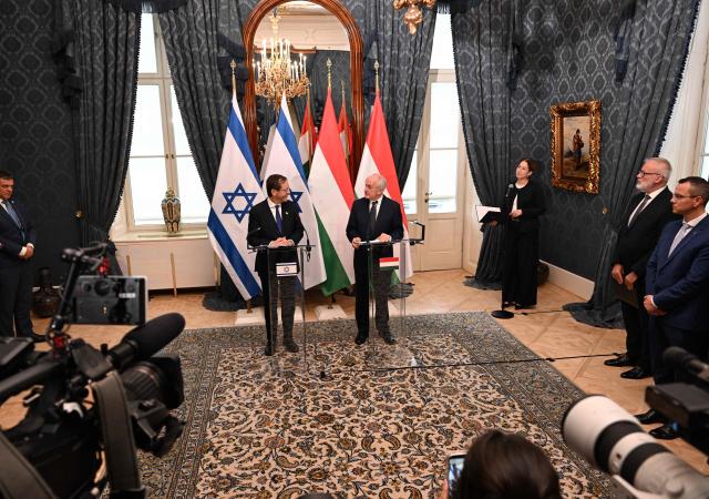 Israeli President Isaac Herzog (L) and his Hungarian counterpart Andras Baka address a press conference at the presidential Sandor Palace in Budapest on October 20, 2026. Herzog is in the Hungarian capital for a high-profile, one-day diplomatic visit, where he will also meet Hungary's Prime Minister Peter Magyar. In the afternoon, President Herzog will address an international conference titled "Voice of the People". (Photo by Attila KISBENEDEK / AFP)