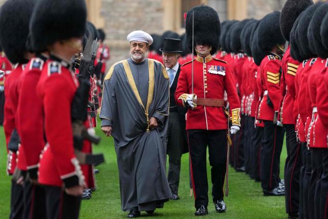 Oman's Sultan Haitham bin Tarik and Britain's King Charles III Inspect of the Guard of Honour in the Quadrangle at Windsor Castle, Windsor, on October 20, 2026, the first day of a three-day State Visit to the United Kingdom by The Sultan of Oman. (Photo by Kirsty Wigglesworth / POOL / AFP)