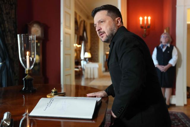 Ukraine's President Volodymyr Zelensky signs the golden book as he meets Norway's King (unseen) on October 20, 2026 at the Royal Palace in Oslo. Ukraine's President Volodymyr Zelensky arrived in Oslo on October 20, 2026 for talks. (Photo by Ole Berg-Rusten / NTB / AFP) / Norway OUT