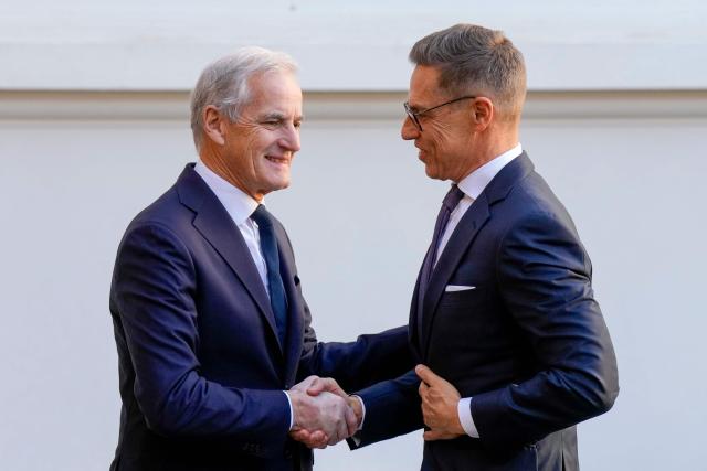 Finnish President Alexander Stubb (R) shakes hands with Norwegian Prime Minister Jonas Gahr Store at the Government's representative facilities in Oslo on October 20, 2026 ahead of Ukraine talks. US envoys Steve Witkoff and Jared Kushner will take part in talks in Oslo on October 20, 2026 with Ukraine President Volodymyr Zelensky and the leaders of Norway and Finland, Norway's government said. (Photo by Cornelius Poppe / NTB / AFP) / Norway OUT