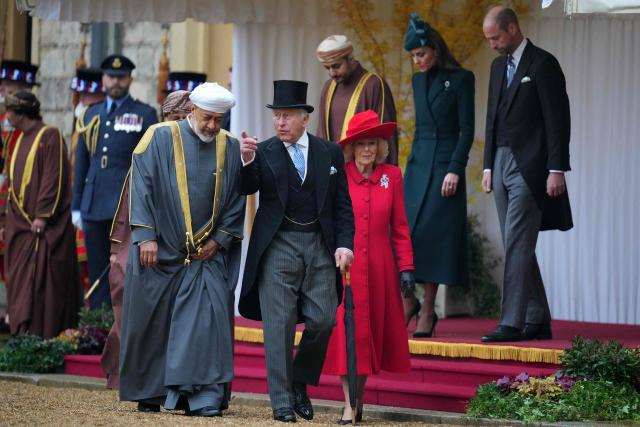 Oman's Sultan Haitham bin Tarik and Britain's King Charles III walk to inspect the Guard of Honour in the Quadrangle at Windsor Castle, Windsor, on October 20, 2026, the first day of a three-day State Visit to the United Kingdom by The Sultan of Oman. (Photo by Kirsty Wigglesworth / POOL / AFP)