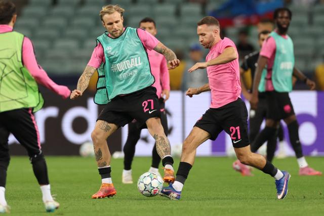 Sabah FK's Polish defender #27 Tymoteusz Puchacz warms up prior to the UEFA Champions League football match between Sabah and Borussia Dortmund at the Baku Olympic Stadium in Baku on October 20, 2026. (Photo by Giorgi ARJEVANIDZE / AFP)