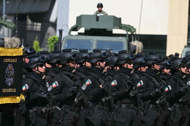 Members of a Mexican special forces unit stand in formation during the signed Interinstitutional Coordination Agreement between the Secretariat of National Defense and the Secretariat of Security and Citizen Protection in Mexico City on October 20, 2026. (Photo by Yuri CORTEZ / AFP)