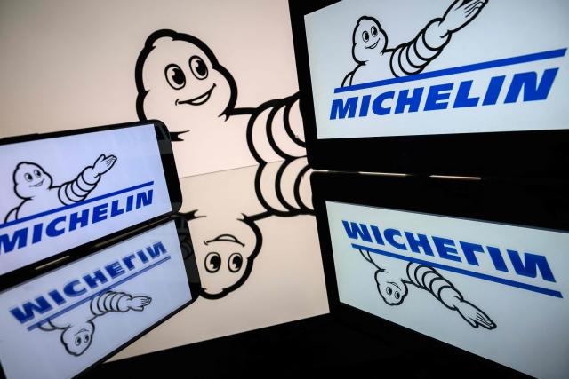 (FILES) This photograph shows screens displaying the logo of the company Michelin, listed on the CAC 40, the main stock market index of the Paris Stock Exchange, in Toulouse on March 31, 2026. French multinational manufacturer Michelin reported on October 20, 2026 stable third-quarter revenue of Ђ19.1 billion—a decrease of 0.5%—and confirmed its targets for the full year 2026. (Photo by Lionel BONAVENTURE / AFP)