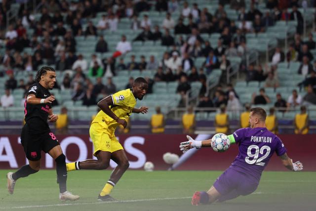 Dortmund's Guinean forward #09 Serhou Guirassy scores the opening goal during the UEFA Champions League football match between Sabah and Borussia Dortmund at the Baku Olympic Stadium in Baku on October 20, 2026. (Photo by Giorgi ARJEVANIDZE / AFP)