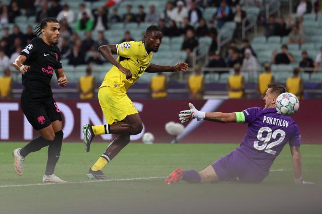 Dortmund's Guinean forward #09 Serhou Guirassy scores the opening goal during the UEFA Champions League football match between Sabah and Borussia Dortmund at the Baku Olympic Stadium in Baku on October 20, 2026. (Photo by Giorgi ARJEVANIDZE / AFP)
