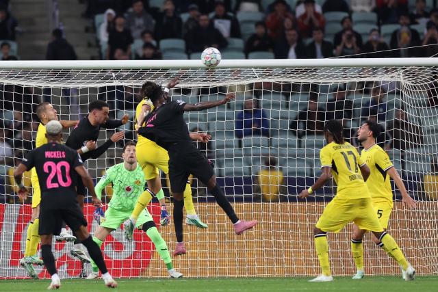 Sabah FK's South African defender #04 Aden McCarthy scores the team's first goal during the UEFA Champions League football match between Sabah and Borussia Dortmund at the Baku Olympic Stadium in Baku on October 20, 2026. (Photo by Giorgi ARJEVANIDZE / AFP)