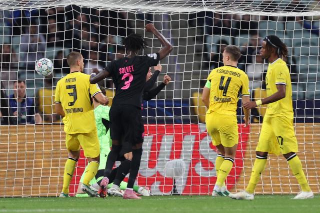 Sabah FK's South African defender #04 Aden McCarthy scores the team's first goal during the UEFA Champions League football match between Sabah and Borussia Dortmund at the Baku Olympic Stadium in Baku on October 20, 2026. (Photo by Giorgi ARJEVANIDZE / AFP)