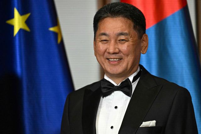 Mongolian President Ukhnaagiin Khurelsukh smiles prior a banquet in his honour at the official presidential residence at the Spreebogen (Amtssitz am Spreebogen) in Berlin on October 20, 2026. Mongolia's President is on a three-day State visit in Germany. (Photo by RALF HIRSCHBERGER / AFP)