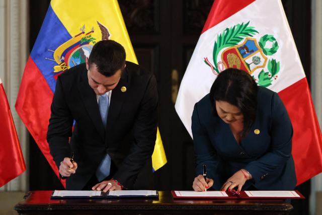 Ecuador's President Daniel Noboa (L) and Peru's President Keiko Fujimori sign the Lima 2026 Presidential Declaration during the 17th Peru-Ecuador Binational Cabinet meeting at the Government Palace in Lima on October 20, 2026. (Photo by Connie FRANCE / AFP)