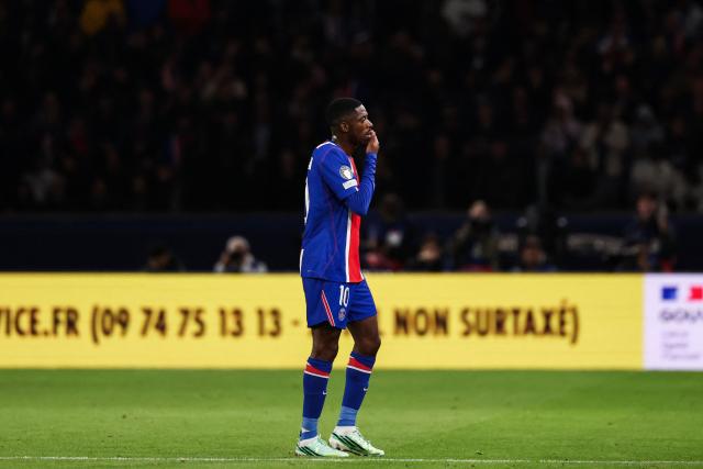 PSG's French forward #10 Ousmane Dembele leaves the pitch after sustaining an injury during the UEFA Champions League first round day 3 football match between Paris Saint Germain (PSG) and FC Barcelona at the Parc de Princes stadium in Paris on October 20, 2026. (Photo by FRANCK FIFE / AFP)