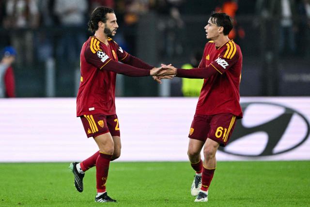 AS Roma's Spanish defender #22 Mario Hermoso (L) celebrates after scoring a goal with his teammate AS Roma's Italian midfielder #61 Niccolò Pisilli  during the UEFA Champions League - 1st round day 3 football match between AS Roma and Slovan Bratislava at the Olympic Stadium in Rome on October 20, 2026. (Photo by Andreas SOLARO / AFP)
