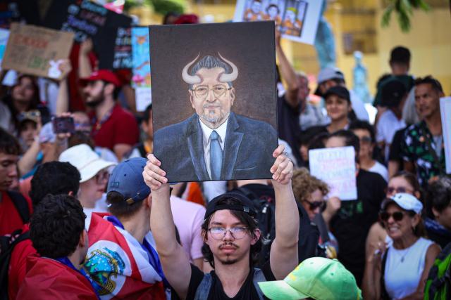 Demonstrators march against President Laura Fernandez's government in San Jose on October 20, 2026. (Photo by JOHN DURAN / AFP)