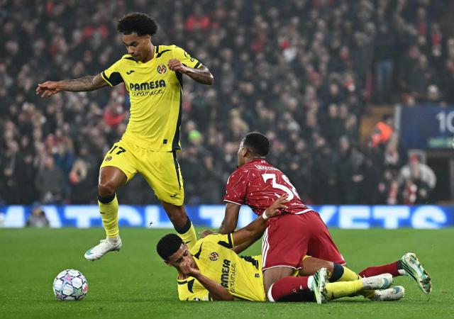 Villarreal's Canadian midfielder #17 Tajon Buchanan runs clear of a challenge during the UEFA Champions League football match between Liverpool and Villareal at Anfield in Liverpool, north west England on October 20, 2026. (Photo by Paul ELLIS / AFP)