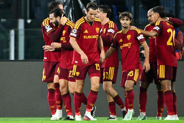 AS Roma's Spanish defender #22 Mario Hermoso (2nd L) celebrates after scoring a goal with his teammates during the UEFA Champions League - 1st round day 3 football match between AS Roma and Slovan Bratislava at the Olympic Stadium in Rome on October 20, 2026. (Photo by Andreas SOLARO / AFP)