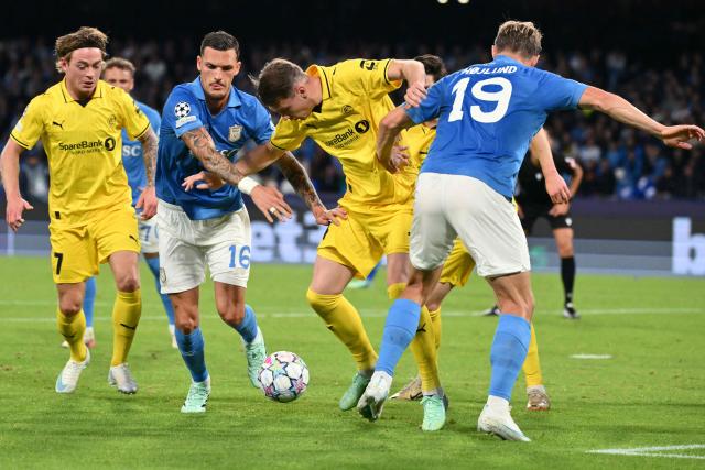 Napoli's Spanish defender #16 Rafa Marin fights for the ball with Bodo/Glimt's Norwegian defender #04 Odin Bjørtuft during the UEFA Champions League - first round day 3 football match between Napoli and Bodo Glimt at the Diego Armando Maradona stadium in Naples on October 20, 2026. (Photo by Alberto PIZZOLI / AFP)