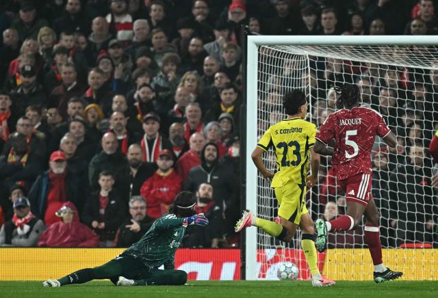Villarreal's Spanish defender #23 Sergi Cardona watches his shot pass Liverpool's Brazilian goalkeeper #01 Alisson Becker as he scores the team's second goal during the UEFA Champions League football match between Liverpool and Villareal at Anfield in Liverpool, north west England on October 20, 2026. (Photo by Paul ELLIS / AFP)