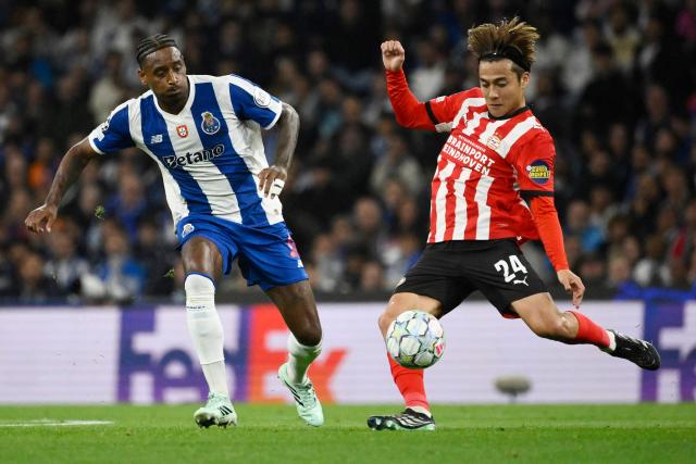FC Porto's Dominicans midfielder #13 Pablo Rosario (L) and PSV Eindhoven's Japanese midfielder #24 Kodai Sano fight for the ball during the UEFA Champions League first round day 3 football match between FC Porto and PSV Eindhoven at Dragao stadium in Porto, on October 20, 2026 (Photo by Miguel RIOPA / AFP)