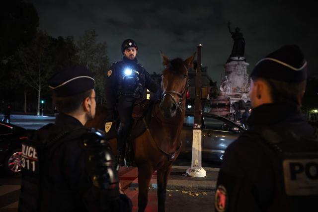 Mounted police patrol near Place de la Republique during a partial curfew for parts of the capital, in Paris on October 20, 2026, after weekend demonstrations over soaring prices degenerated into some of the worst street violence in recent years. Paris police ordered a new curfew for parts of the city for October 20, after a curfew on the previous night that authorities said resulted in calm being restored following weekend riots and looting. The fresh curfew runs from 2100 GMT on October 20, 2026 to 0400 GMT October 21, 2026 and applies to the Republique public square in the city's central east, where many weekend clashes took place, and in the central les Halles district which is full of shops as well as nearby train stations. (Photo by SIMON WOHLFAHRT / AFP)