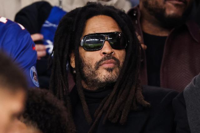 US singer-songwriter Lenny Kravitz looks on ahead of the UEFA Champions League first round day 3 football match between Paris Saint-Germain (PSG) and FC Barcelona at the Parc de Princes stadium in Paris on October 20, 2026. (Photo by FRANCK FIFE / AFP)