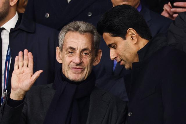 France's former President Nicolas Sarkozy and Paris Saint Germain's Qatari President  Nasser al-Khelaifi attend the UEFA Champions League first round day 3 football match between Paris Saint-Germain (PSG) and FC Barcelona at the Parc de Princes stadium in Paris on October 20, 2026. (Photo by FRANCK FIFE / AFP)