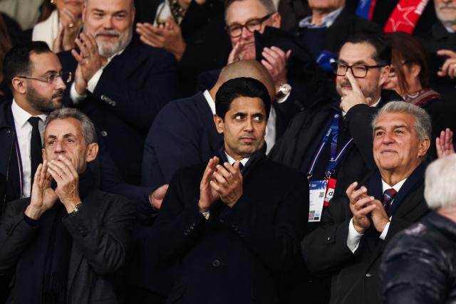 France's former President Nicolas Sarkozy, Paris Saint Germain's Qatari President  Nasser al-Khelaifi and FC Barcelona President Joan Laporta attend the UEFA Champions League first round day 3 football match between Paris Saint-Germain (PSG) and FC Barcelona at the Parc de Princes stadium in Paris on October 20, 2026. (Photo by FRANCK FIFE / AFP)