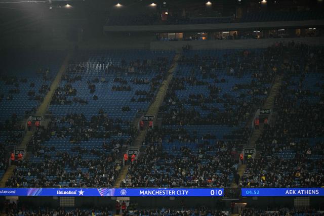 Empty seats are pictured during the UEFA Champions League football match between Manchester City and AEK Athens at the Etihad Stadium in Manchester, north west England, on October 20, 2026. (Photo by Oli SCARFF / AFP)