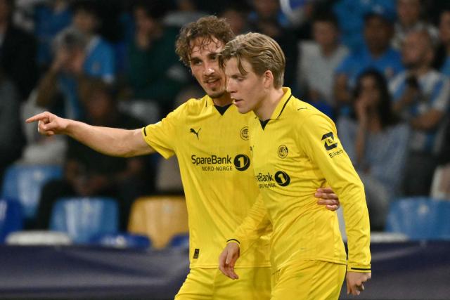 Bodo/Glimt's Norwegian forward #09 Andreas Helmersen celebrates scoring his team's second goal with Bodo/Glimt's Norwegian forward #10 Jens Petter Hauge during the UEFA Champions League - first round day 3 football match between Napoli and Bodo Glimt at the Diego Armando Maradona stadium in Naples on October 20, 2026. (Photo by Alberto PIZZOLI / AFP)