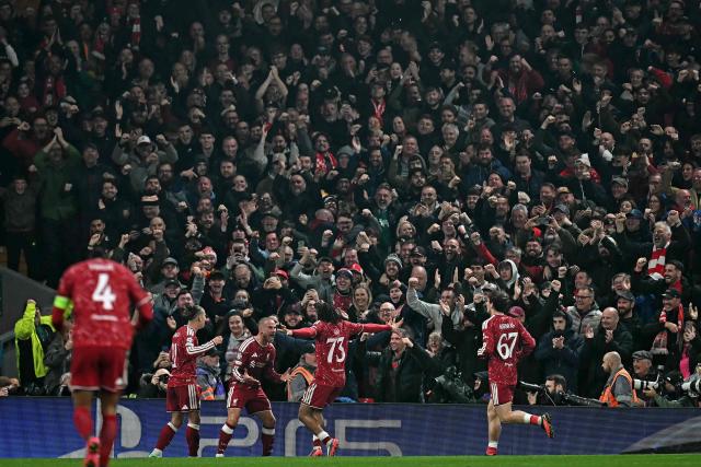 Liverpool's Argentinian midfielder #10 Alexis Mac Allister (3L) celebrates scoring the team's third goal during the UEFA Champions League football match between Liverpool and Villareal at Anfield in Liverpool, north west England on October 20, 2026. (Photo by Paul ELLIS / AFP)