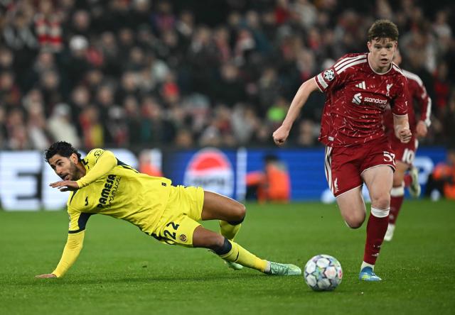 Liverpool's English midfielder #53 James McConnell (R) outruns a challenge from Villarreal's Spanish striker #22 Ayoze Perez Gutierrez during the UEFA Champions League football match between Liverpool and Villareal at Anfield in Liverpool, north west England on October 20, 2026. (Photo by Paul ELLIS / AFP)