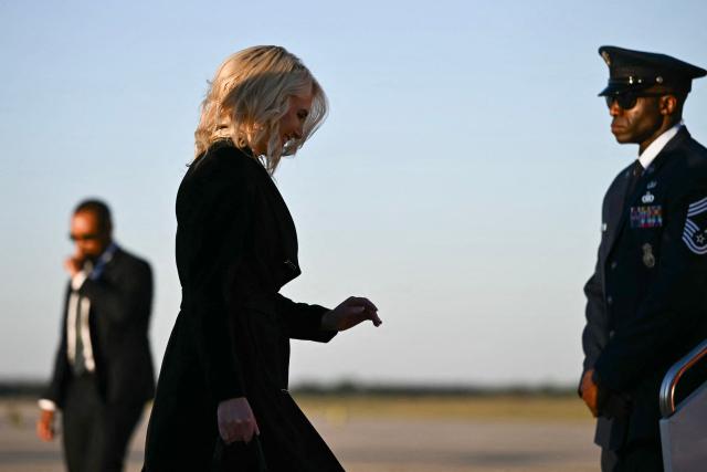 Executive assistant to the president Natalie Harp boards Air Force One at Joint Base Andrews in Maryland, on October 20, 2026. President Trump is travelling to North Carolina to support Republican candidates. (Photo by Kent NISHIMURA / AFP)