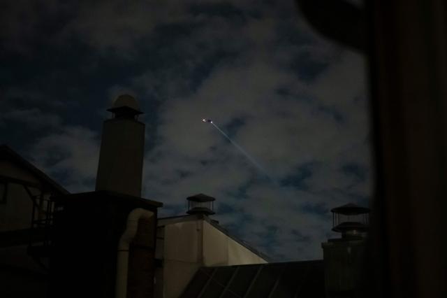 This photograph shows a helicopter patroling over central Paris to enforce a partial curfew of the capital, in Paris, on October 20, 2026, after weekend demonstrations over soaring prices degenerated into some of the worst street violence in recent years. Paris police ordered a new curfew for parts of the city for October 20, after a curfew on the previous night that authorities said resulted in calm being restored following weekend riots and looting. The fresh curfew runs from 2100 GMT on October 20, 2026 to 0400 GMT October 21, 2026 and applies to the Republique public square in the city's central east, where many weekend clashes took place, and in the central les Halles district which is full of shops as well as nearby train stations. (Photo by Olivier MORIN / AFP)