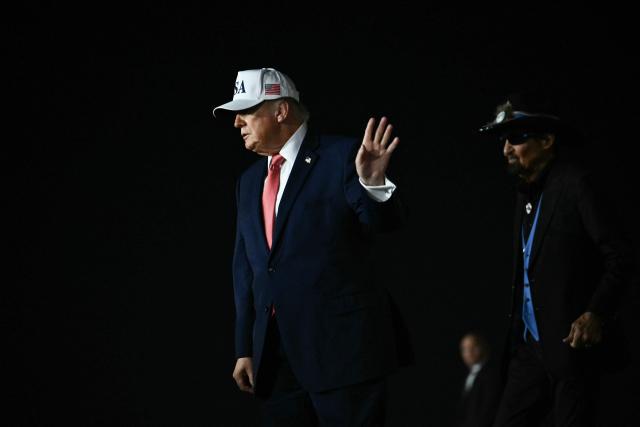 US President Donald Trump disembarks Air Force One at Pitt-Greenville Airport in Greenville, North Carolina, on October 20, 2026. (Photo by Kent NISHIMURA / AFP)